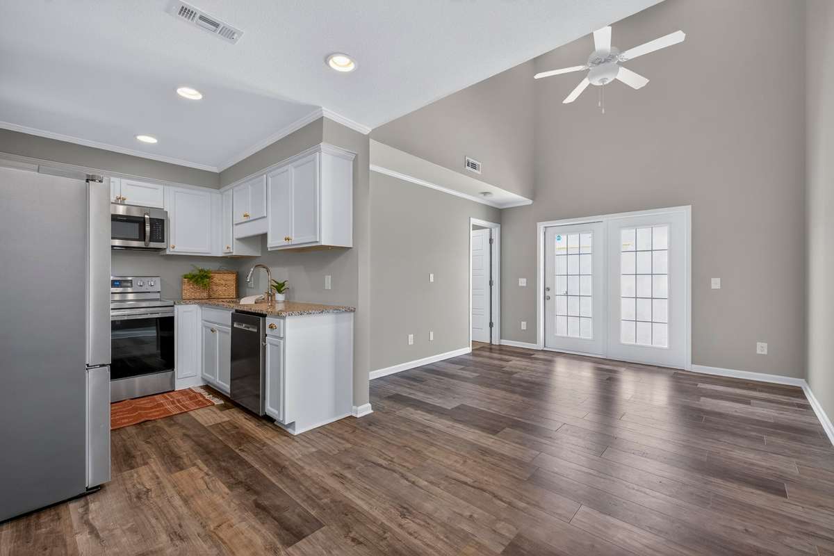 Another view of the living room/dining area and kitchen