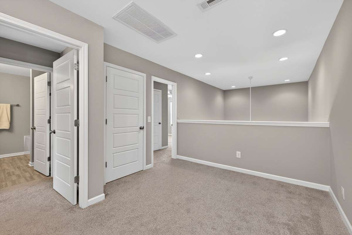 Versatile loft area ideal for a second living space, workspace, or play area.
