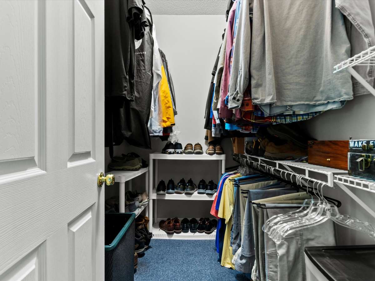 Primary Bathroom- wood flooring, two walk in closets