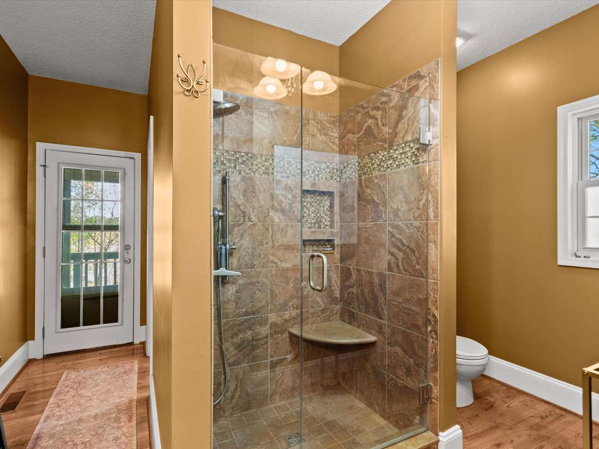 Primary Bathroom- wood flooring, two walk in closets