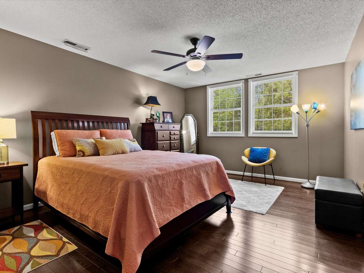 Bedroom- Wood flooring, ceiling fan, walk-in closet