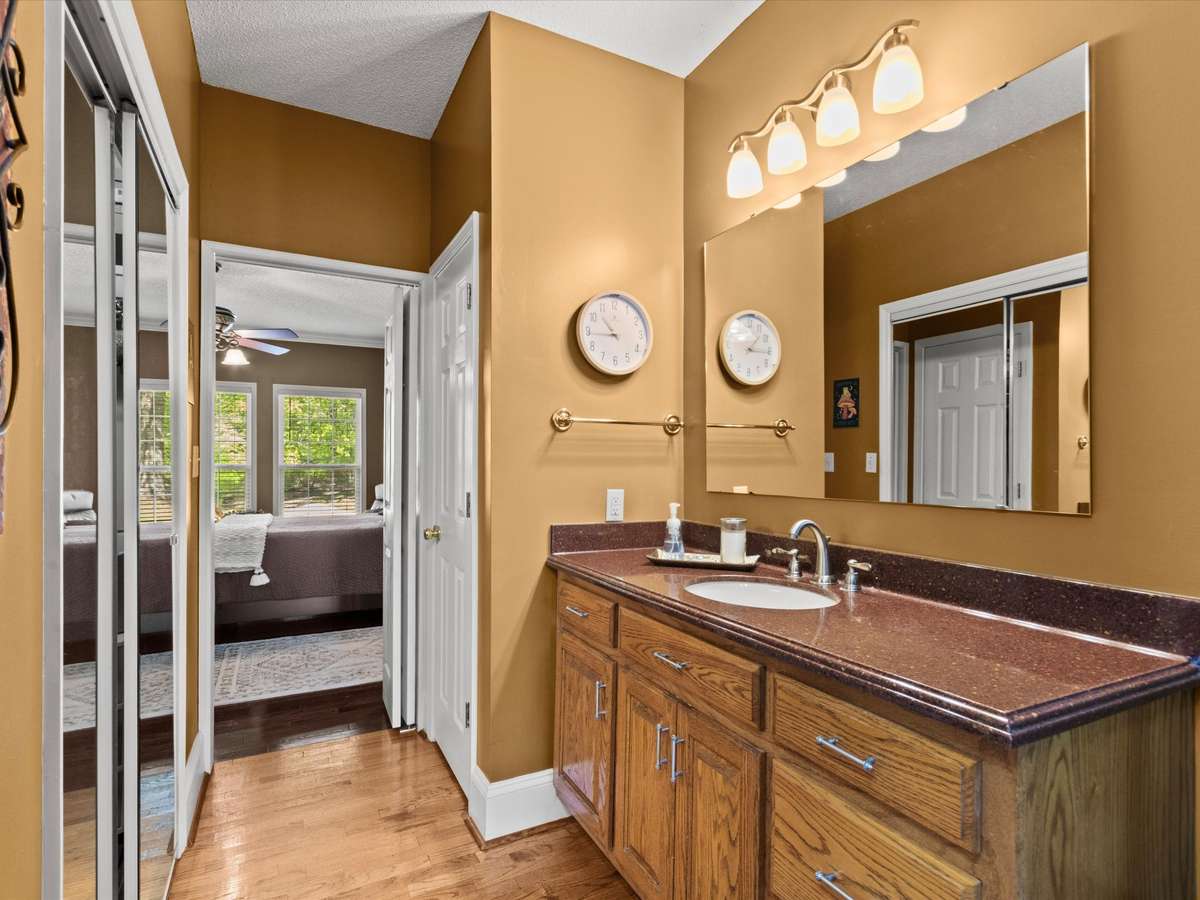 Primary Bathroom- wood flooring, two walk in closets