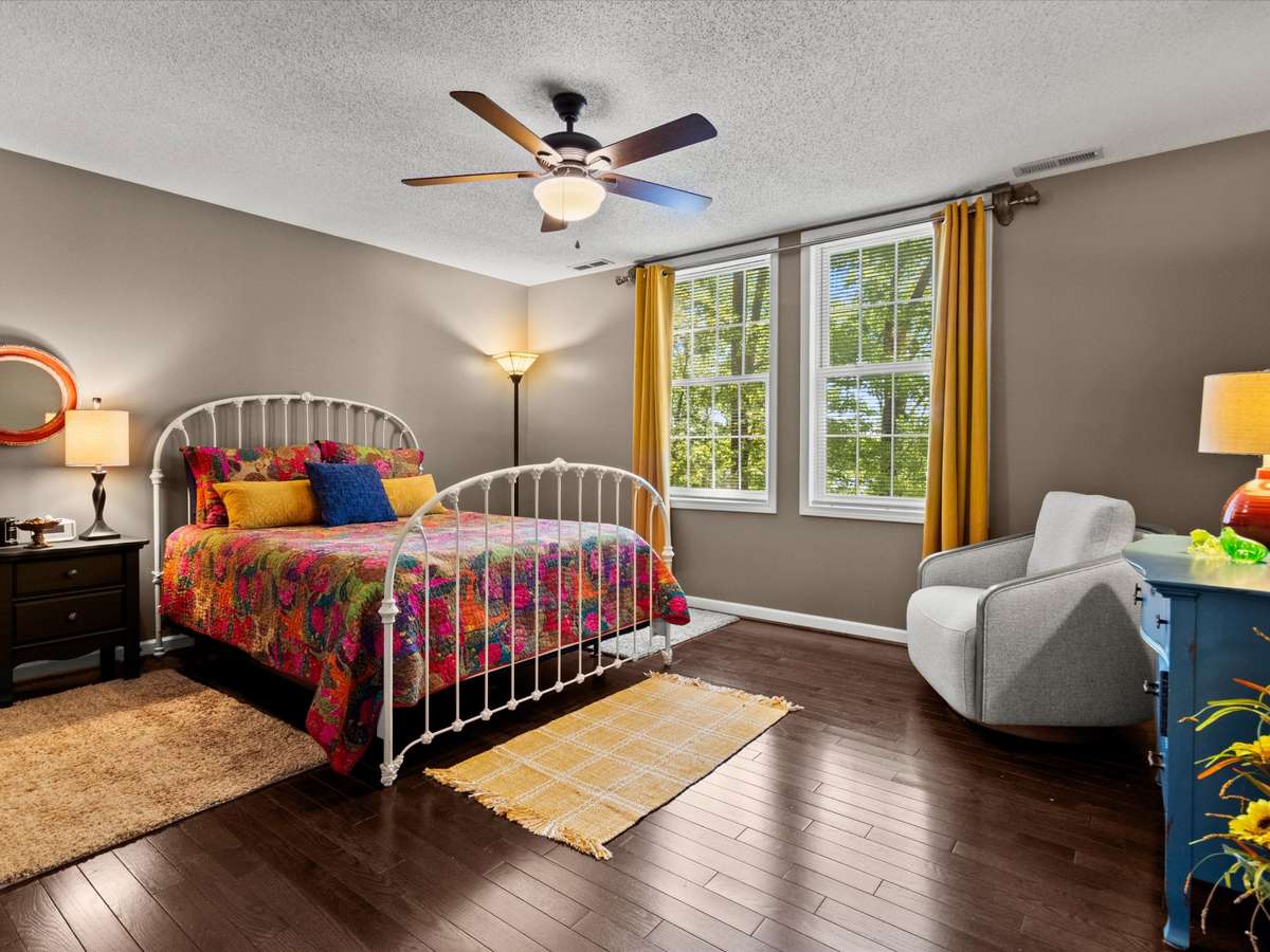 Bedroom- Wood flooring, ceiling fan, walk in closet