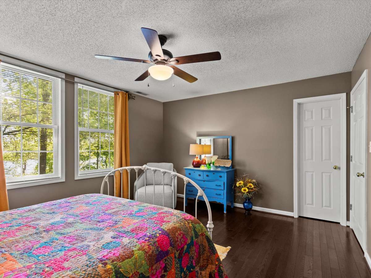 Bedroom- Wood flooring, ceiling fan, walk in closet