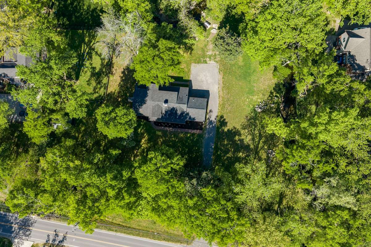 Surrounded by a canopy of mature trees, this home is truly something special.