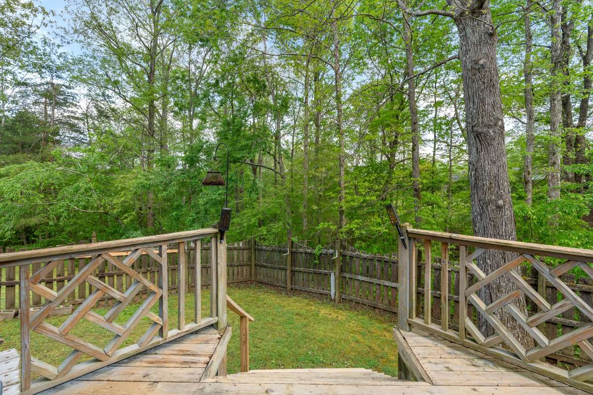 Backyard off of deck is completely fenced. Great for pets.