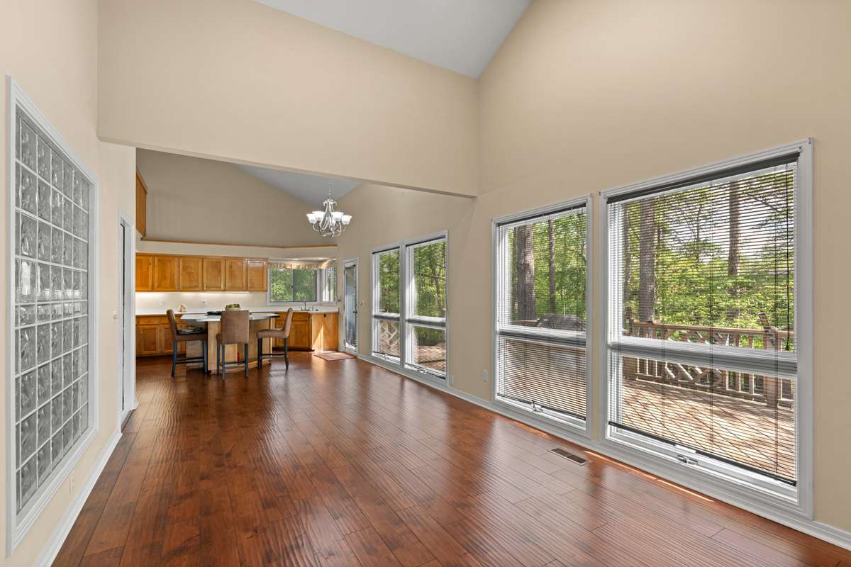 From Den looking through Dining Room and Kitchen. Big window and door on left is Sauna/Hot Tub.