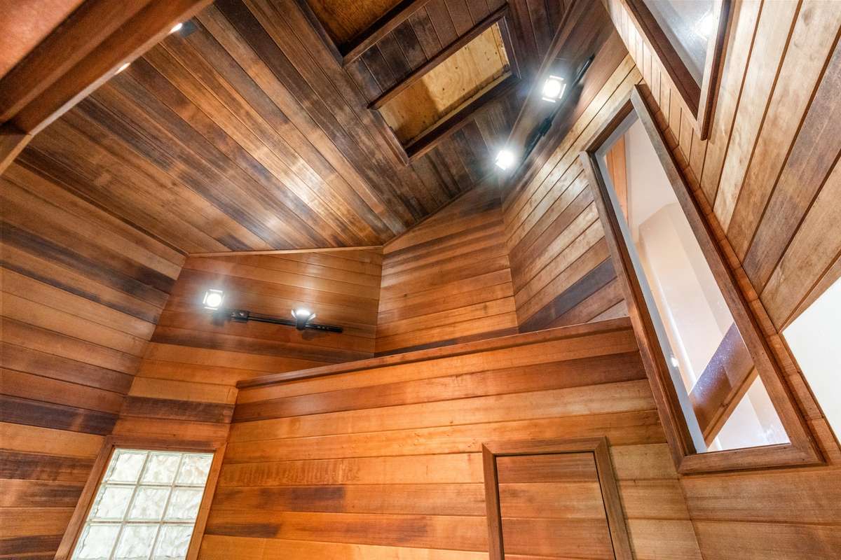 Beautiful woodwork with several lights.