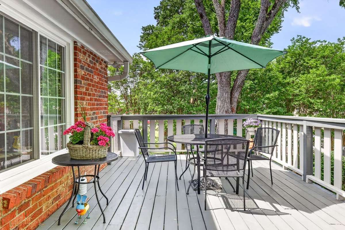 The deck offers a relaxing space with pretty views, an area to grill out or host a social gathering. The back door offers easy access to the kitchen and living room.