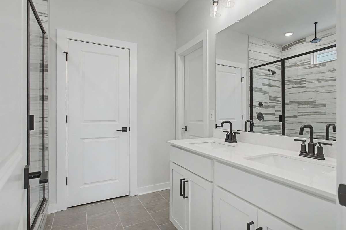 Primary Bathroom with Roman Shower, Water Closet, and Walk-In Closet