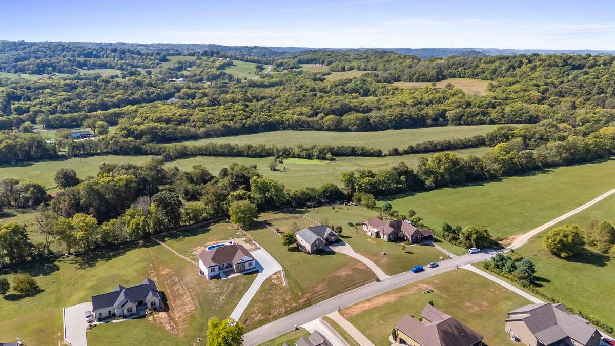 Small peaceful neighborhood surrounded by beautiful countryside.