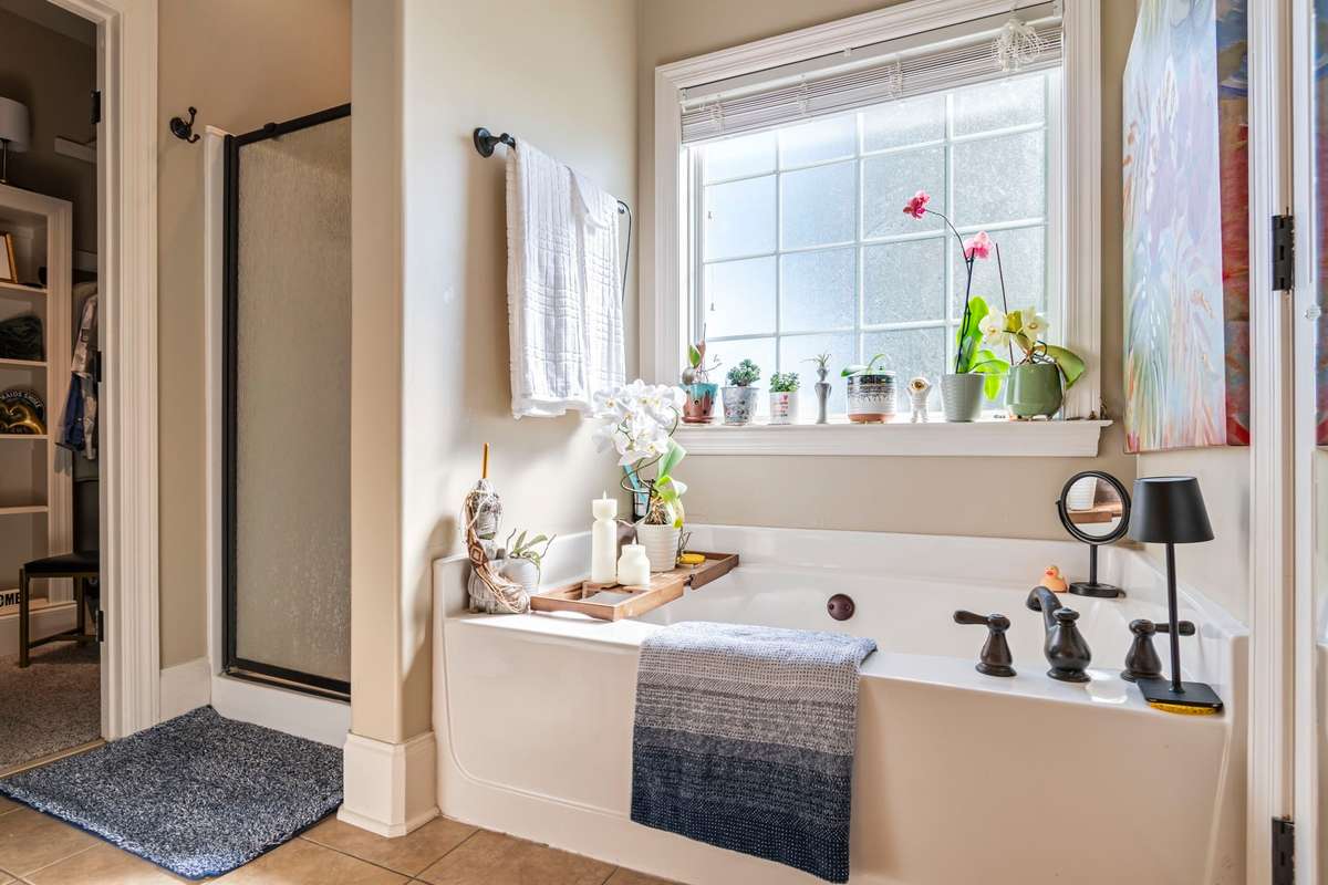 Separate shower and tub in primary bath.