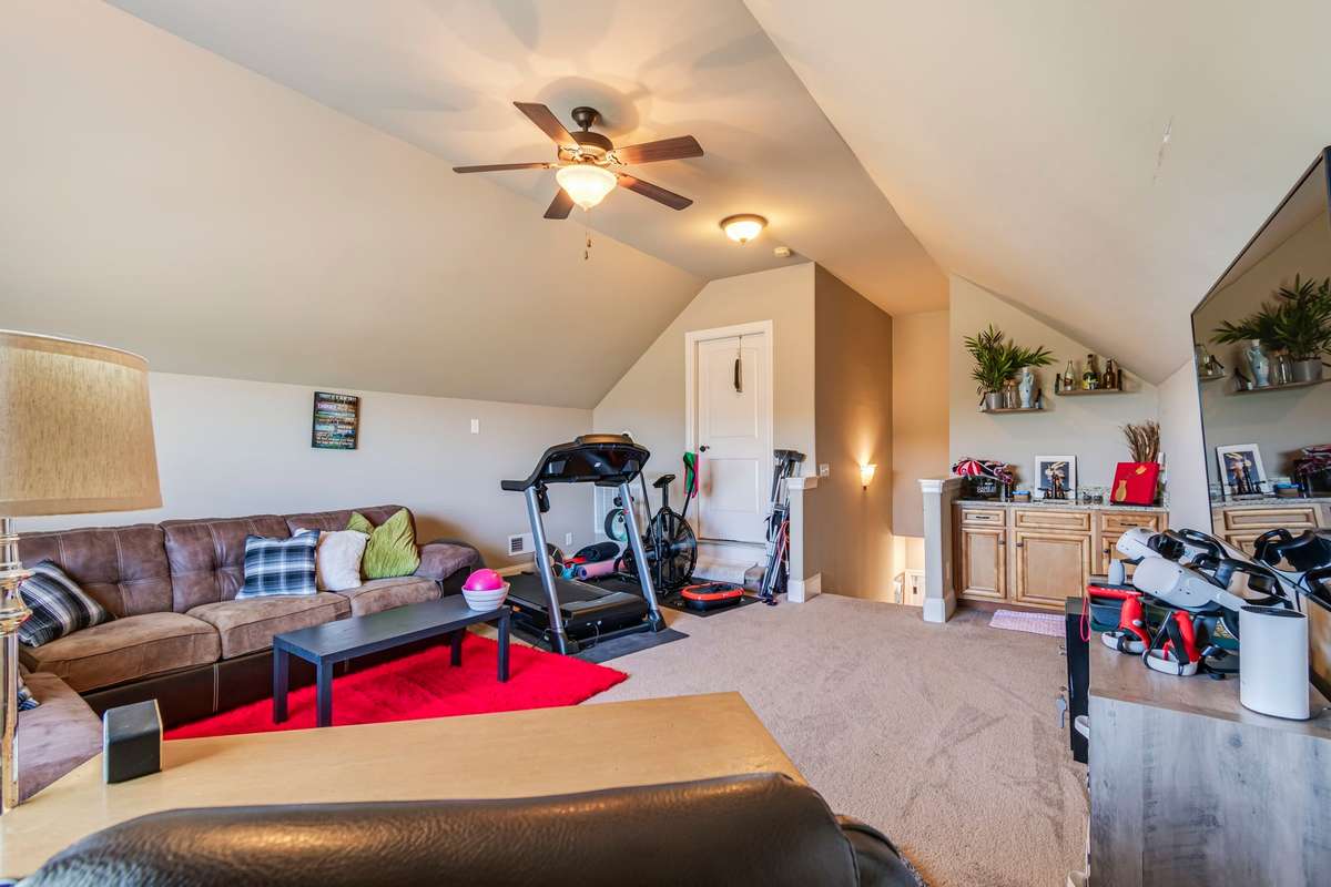Ceiling fan in bonus room.