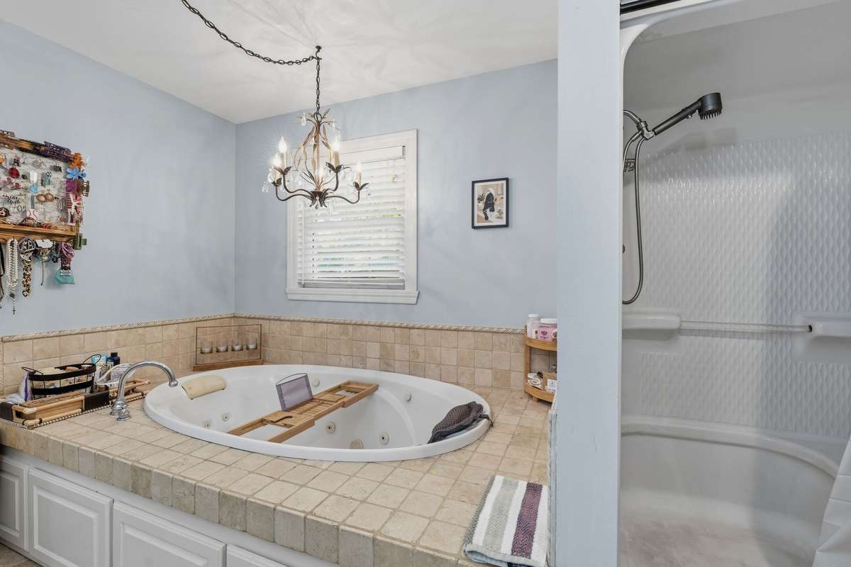 HERE'S ANOTHER VIEW OF THE SOAKING TUB AND THE WALK-IN SHOWER THAT IS RIGHT NEXT TO IT - INVITING!!