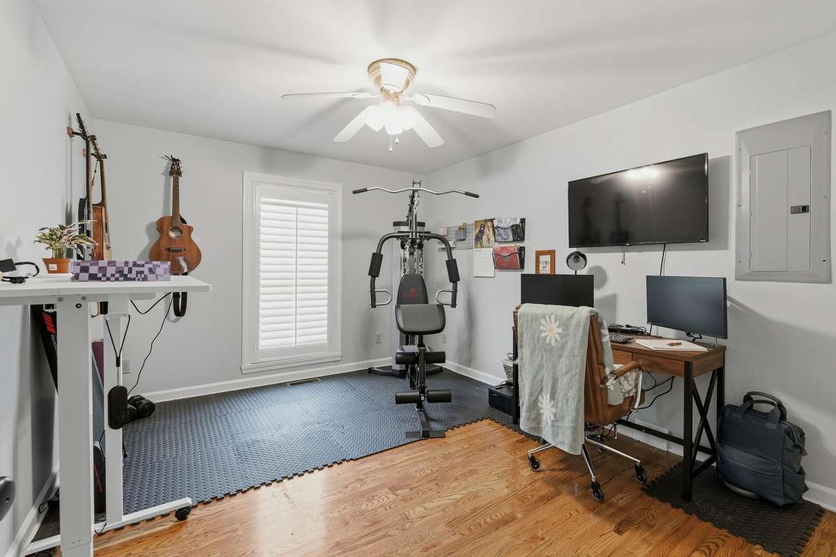 HERE'S ANOTHER BEDROOM - THE 3RD - AND IT IS PRESENTLY USED AS AN OFFICE/EXERCISE ROOM.  SO ROOMY!!