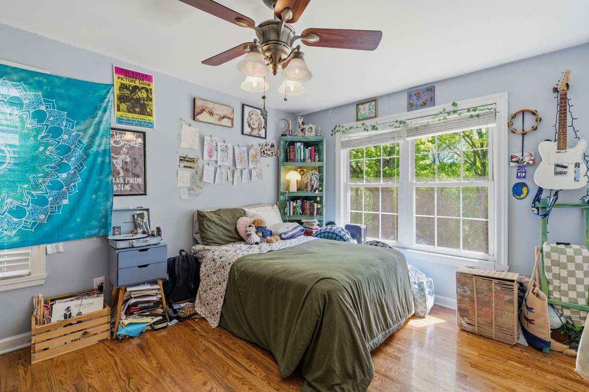 AND.... HERE IS THE 4TH BEDROOM CURRENTLY OCCUPIED BY A TEENAGER (CAN YOU TELL?) ROOMY AND SUNNY - IT LOOKS OUT OVER DECK AND VERY PRIVATE BACK YARD.