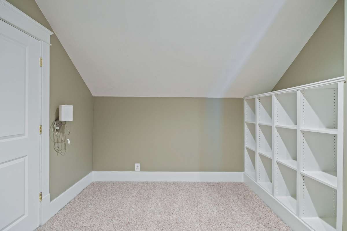 This room also includes built-in bookshelves, adding both charm and functionality