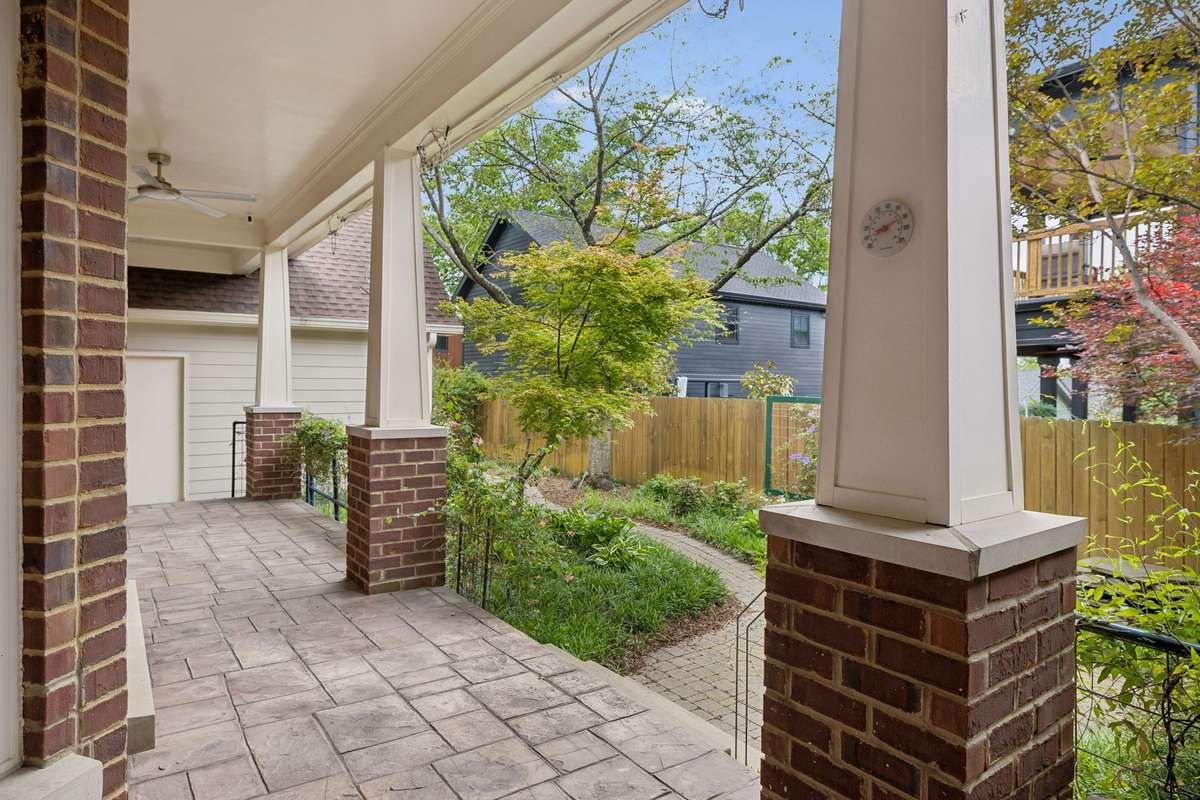 Spacious covered back porch with ceiling fans. Perfect for relaxing or entertaining outdoors