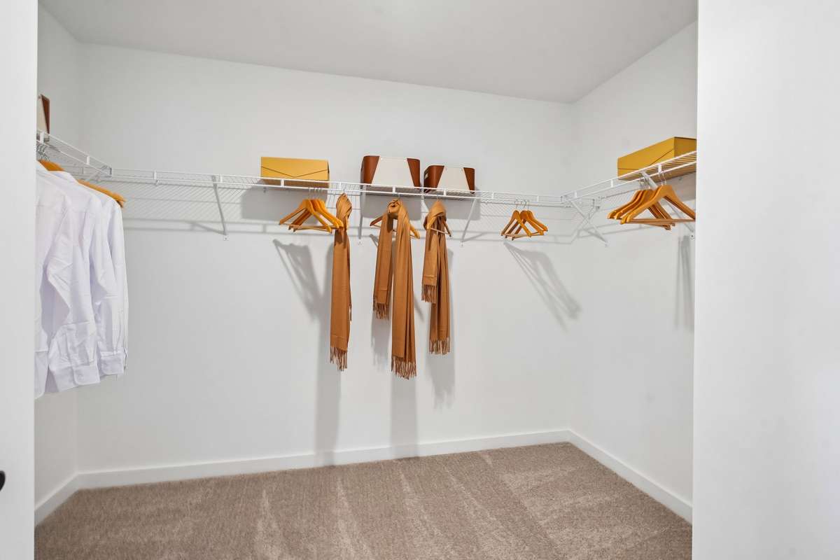 Amazing walk in closet in owner's suite. Picture is from furnished model home in the community