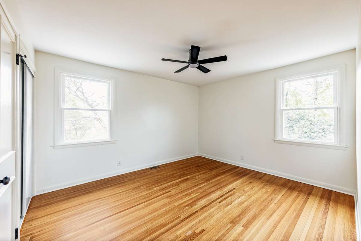 Non ai enhanced photo of the primary suite.