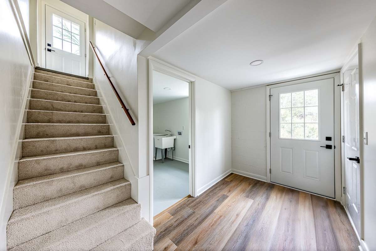 Non ai enhanced photo of the downstairs "mudroom" area. A great place for you to design.