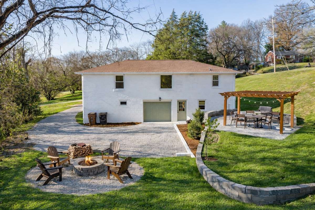 This backyard space could be really special. With 1 acre, could you imagine setting up something like this? Or, your design may be way better!
(**picture was ai enhanced to show the way the backyard could look**)