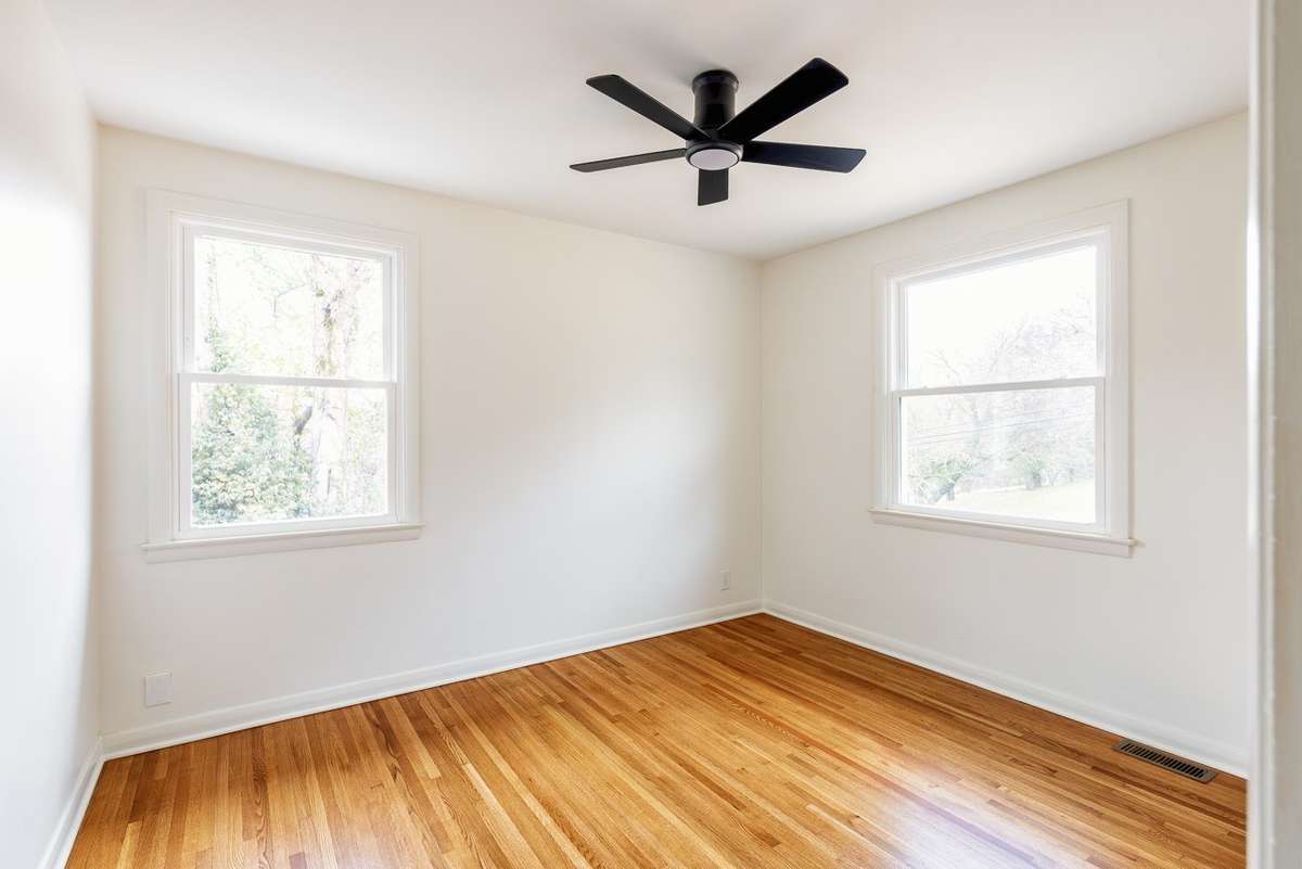 Non ai enhanced photo of one of the secondary bedrooms.