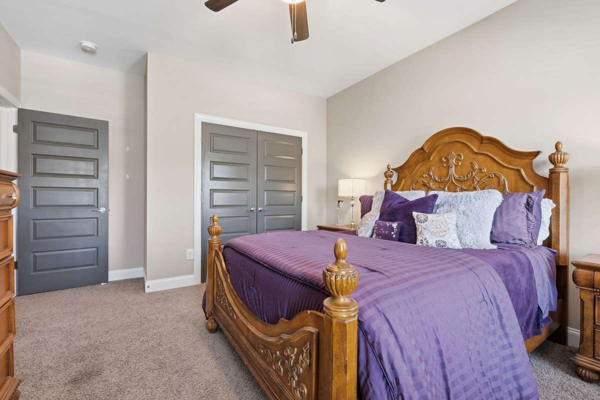 Bedroom 3 Is very light inside and is located on the front of the house and features a ceiling fan and spacious closet.