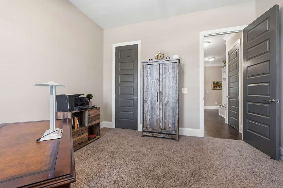 This is the second bedroom downstairs and is located down the hall from the owners suite.  Great for a first floor office, nursery or perhaps in-law suite.  It features a large closet and separate full bath.