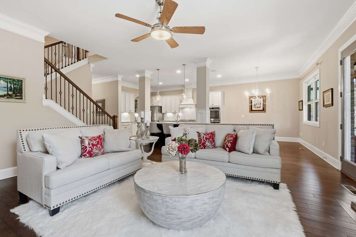 Generous Sized Family Room with Finished Wood floors and a gorgeous stone fireplace and gas logs.