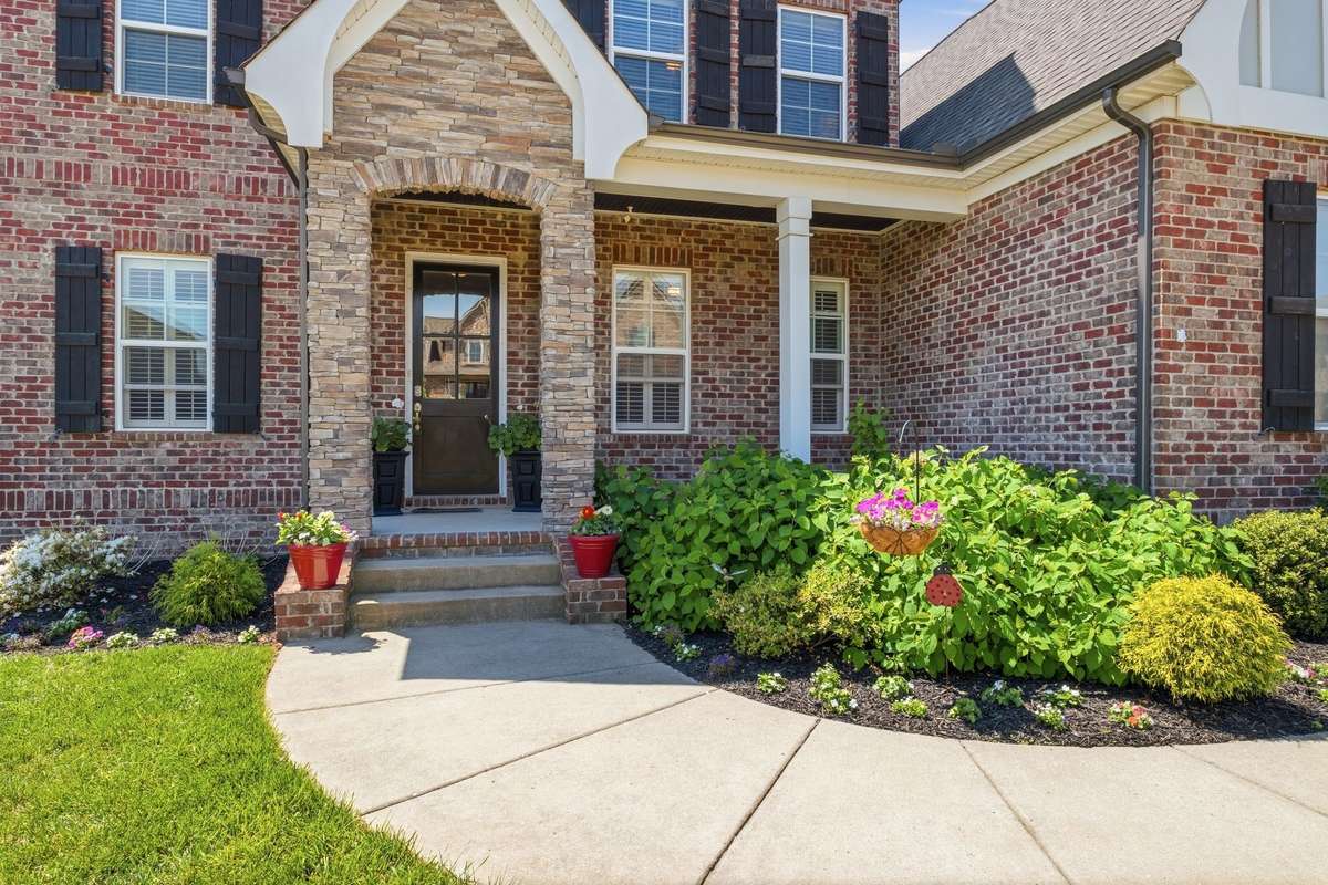 Covered Front Porch for those leisurely days - just add a swing or two rocking chairs!
