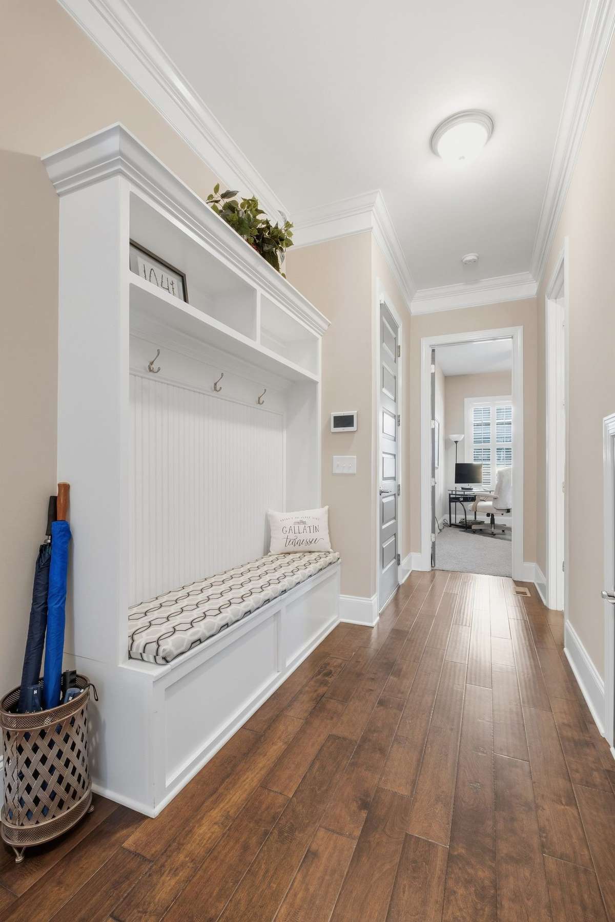 Built in Cubbies and Bench with storage located next to access to the garage.