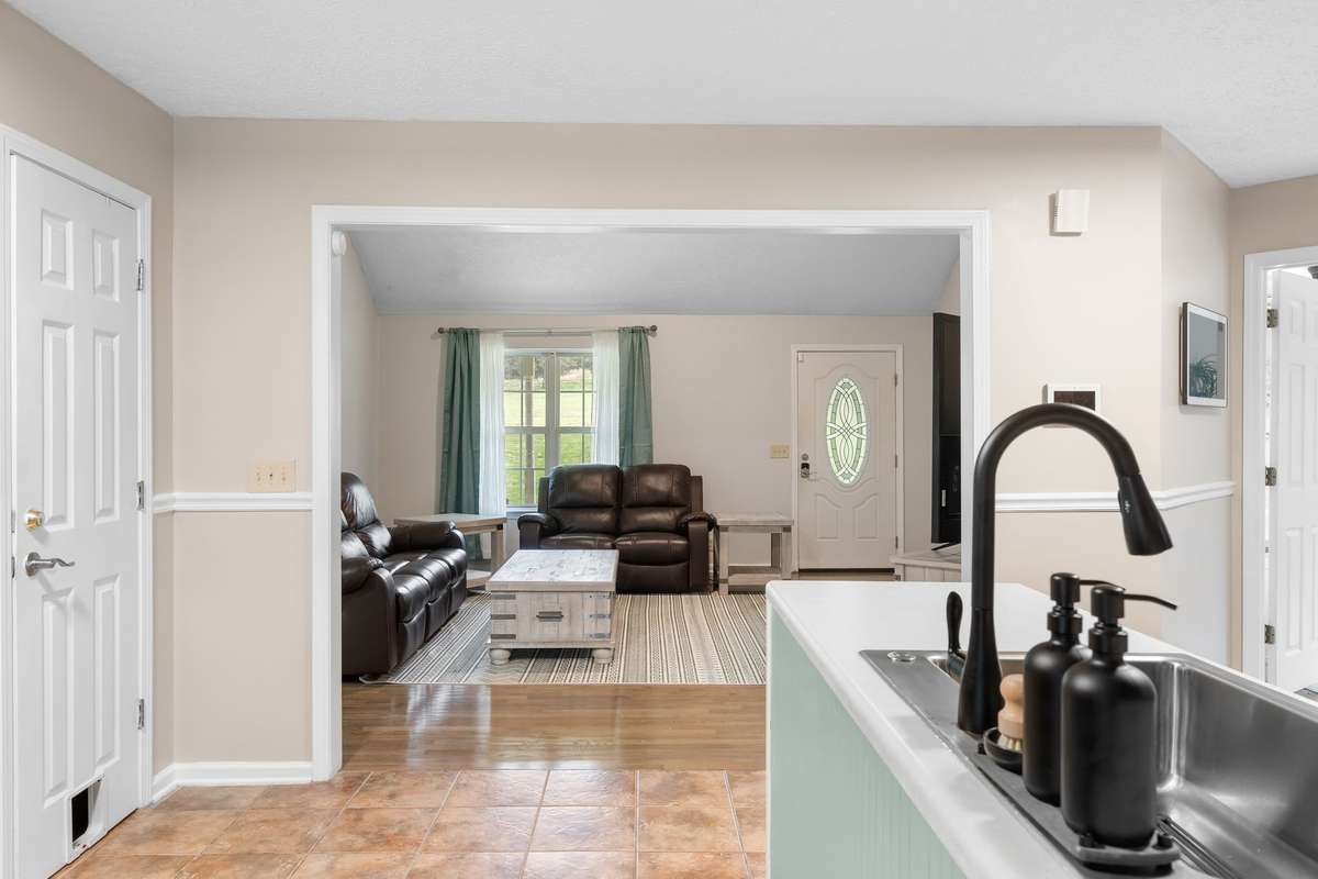 Kitchen opens to living area, perfect for entertaining!