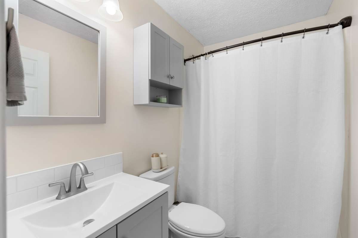 Shared bathroom easily accessible from both secondary bedrooms.