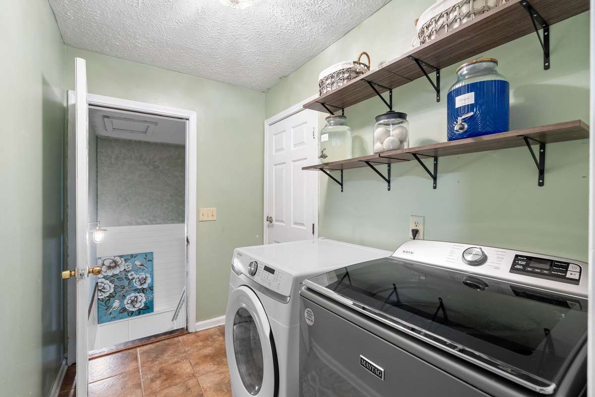 Laundry room with handy open shelving!