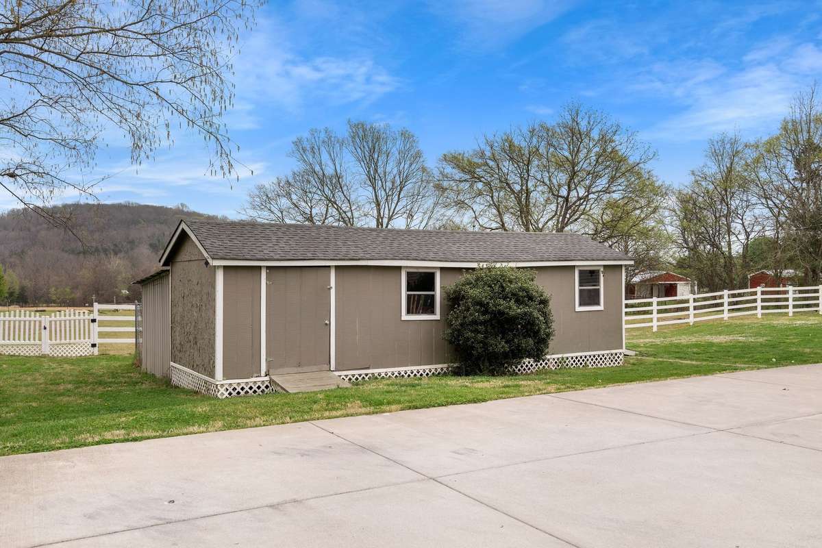 Detached outbuilding offers extra storage or workspace!