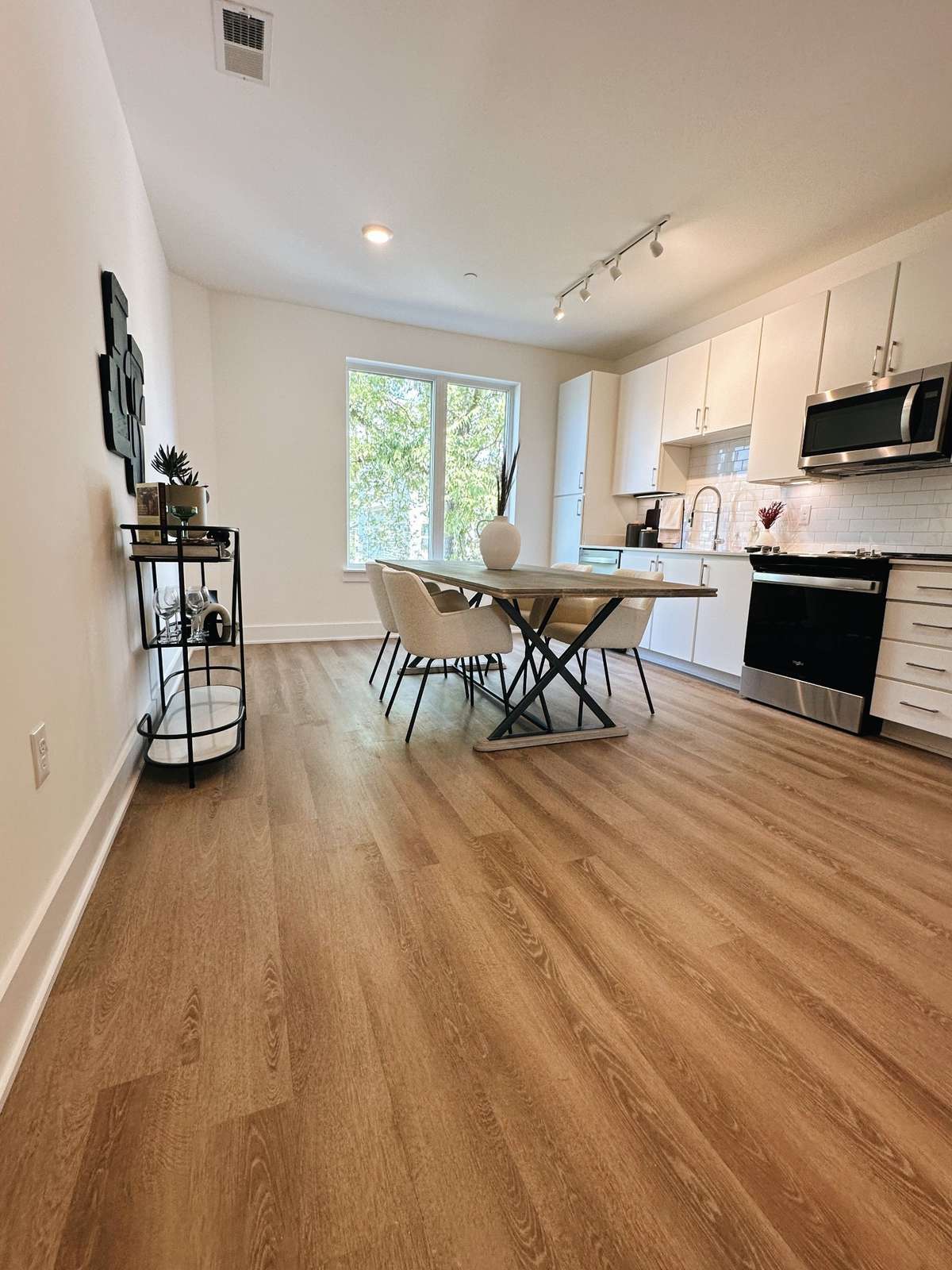 At the top of the stairs on the 2nd floor, you're welcomed into a modern/open kitchen that is perfect for entertaining.