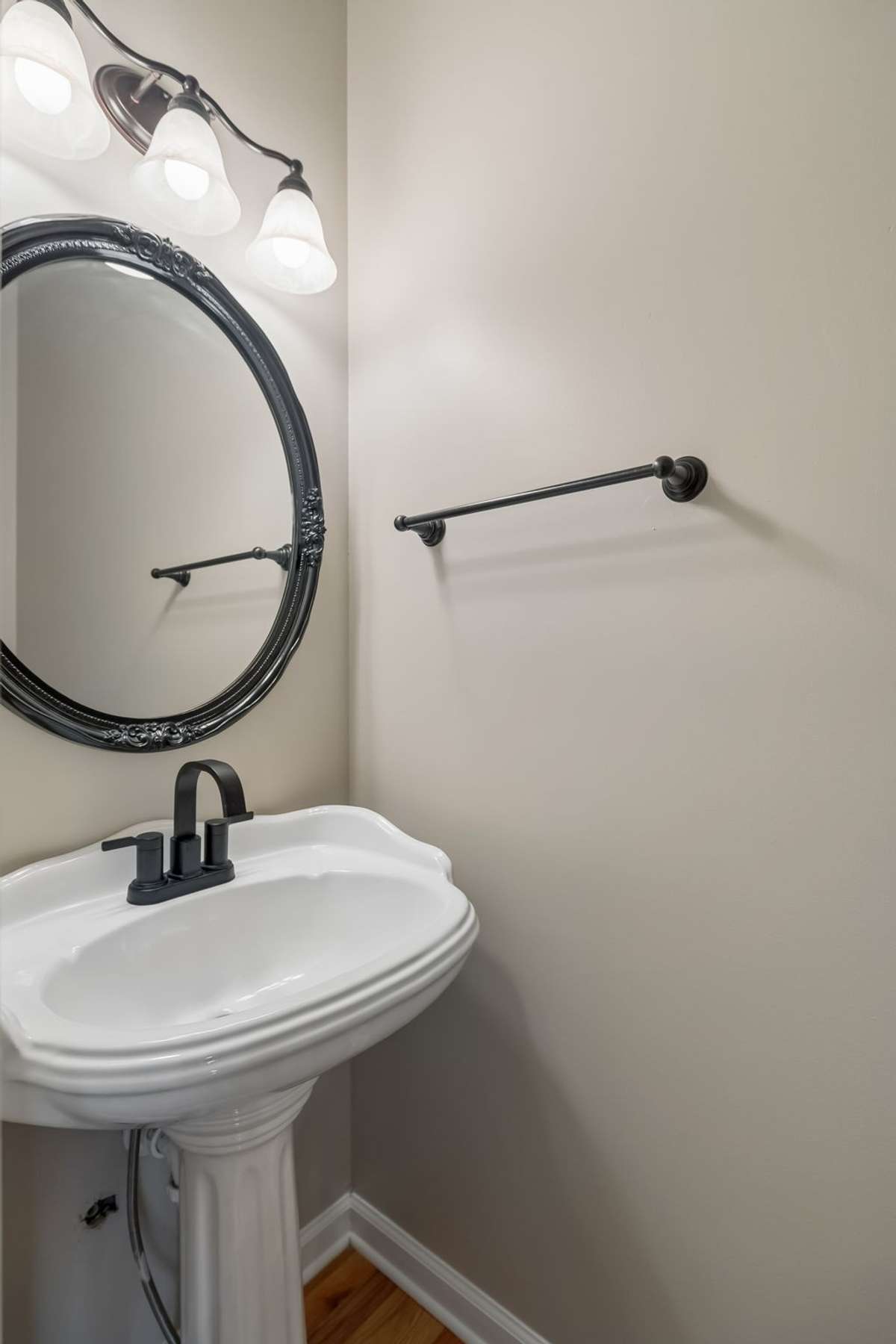 Off the Kitchen, there's a hallway with a Half Bath.