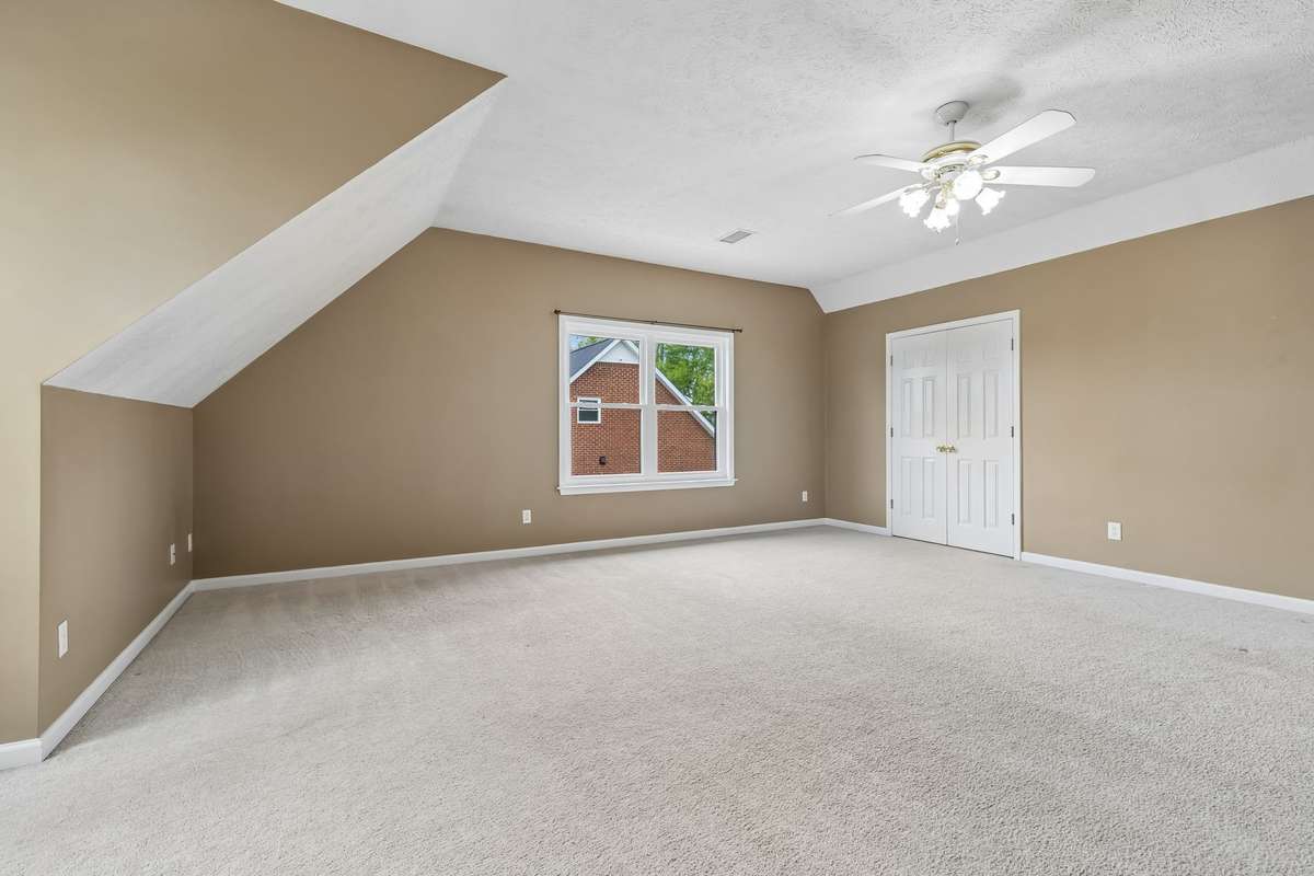 The Bonus/Media Room which could be Bedroom 4 if needed. Closet is the double-doorway with access to storage area in the attic as well!