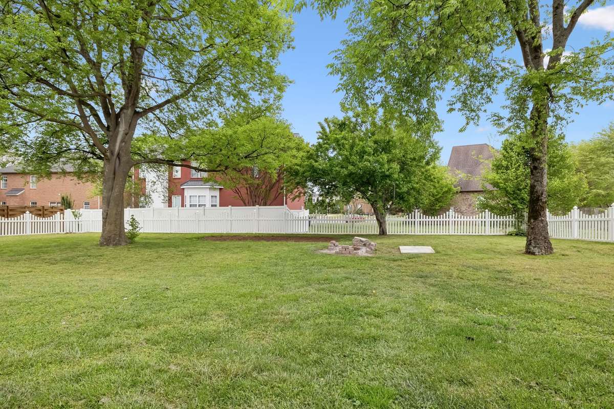 There's some mature trees in the back yard as well with nice yard and fenced with a white picket fence!