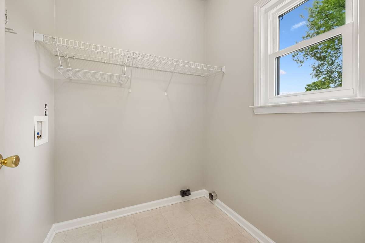 The Laundry Room is off the Kitchen and will accommodate an electric washer & dryer.