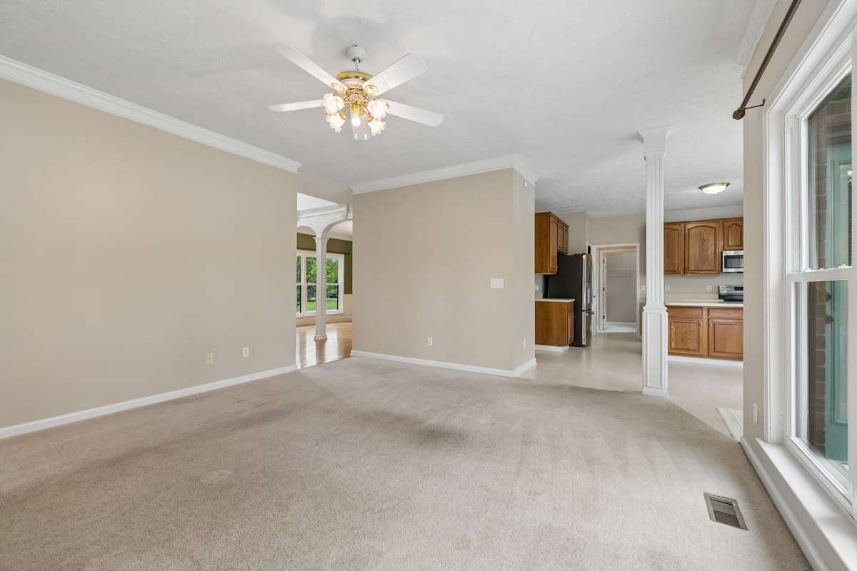 Living Room looking toward the Kitchen and Dining areas! There's been many paint updates throughout!
