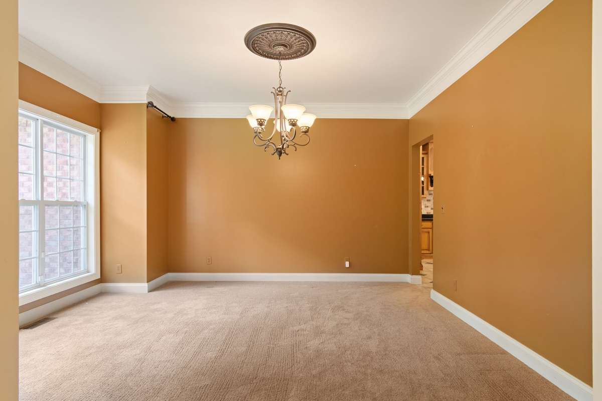 Formal dining room adjacent to kitchen