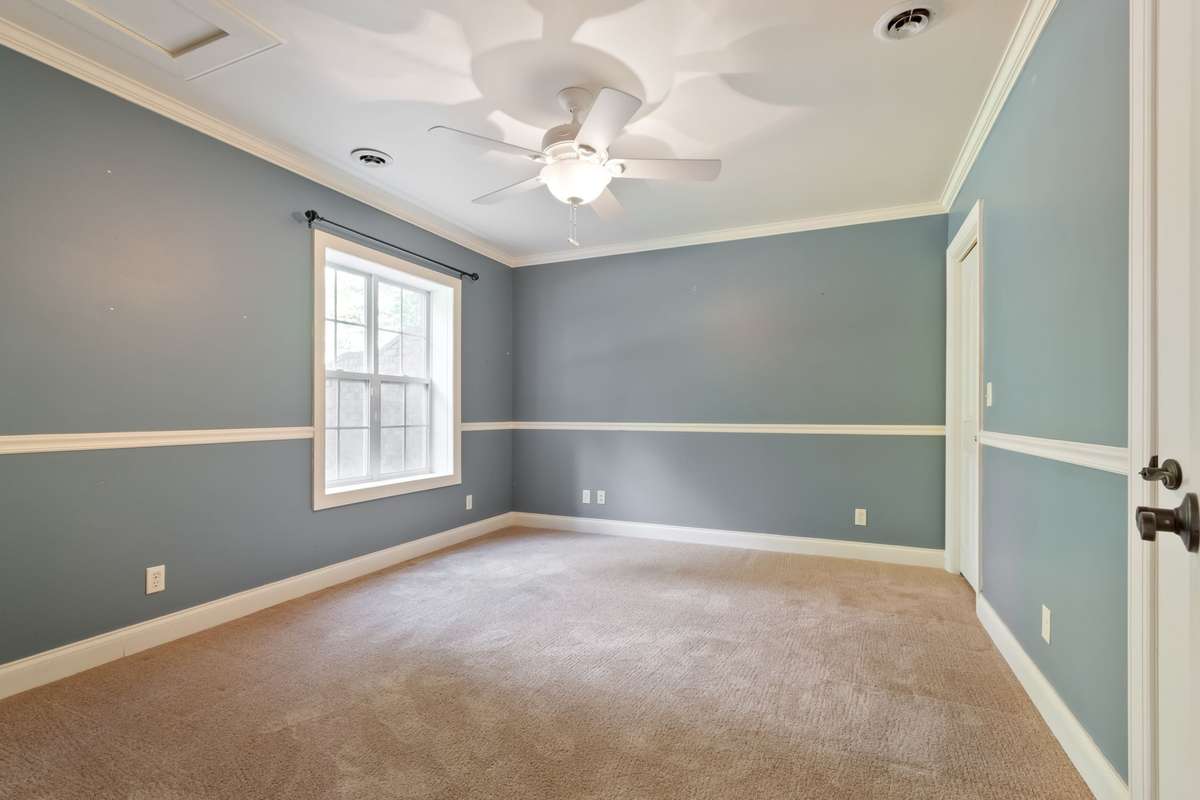Bedroom 4 on lower level with adjacent full bath