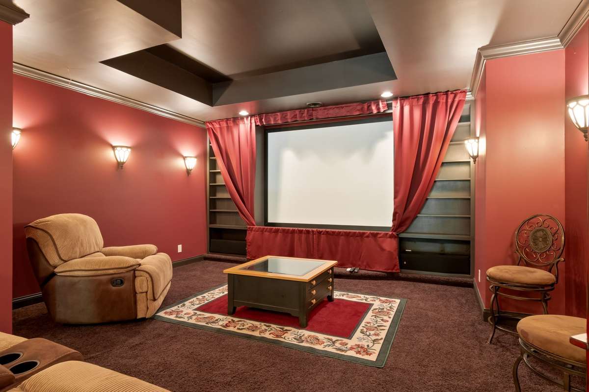 Theater room on lower level. Projector conveys with house