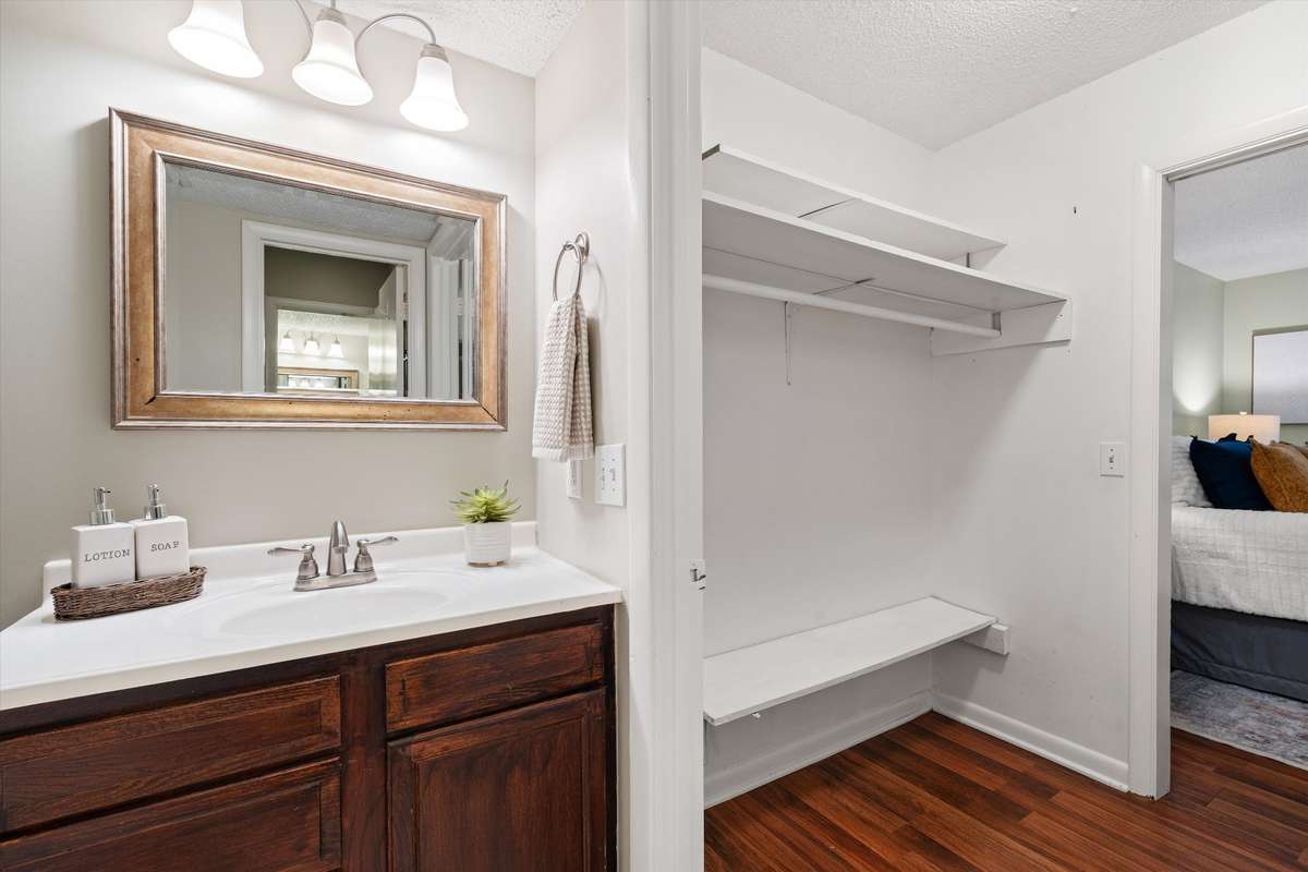Primary Bedroom: Bathroom and Closet view. (Has it's own toilet and sink, with door to shower room.