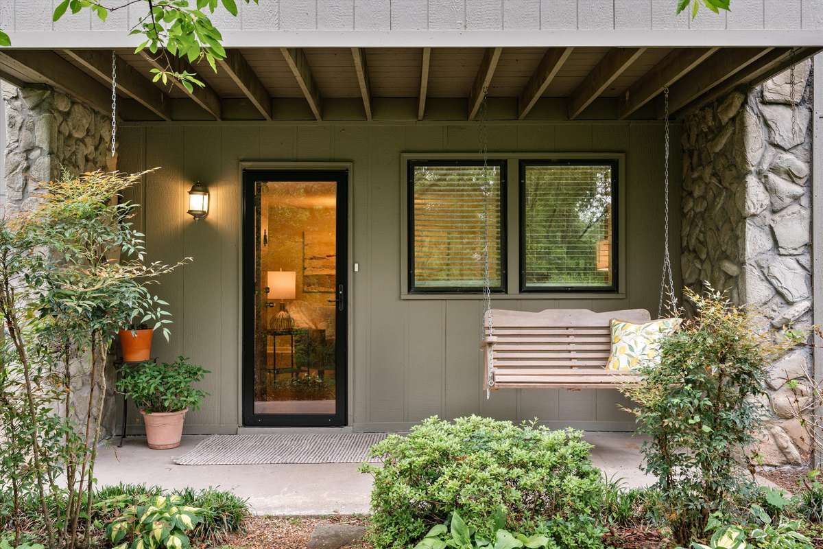 A convenient patio with beautiful views of greenspace and close access to assigned and ample unassigned parking