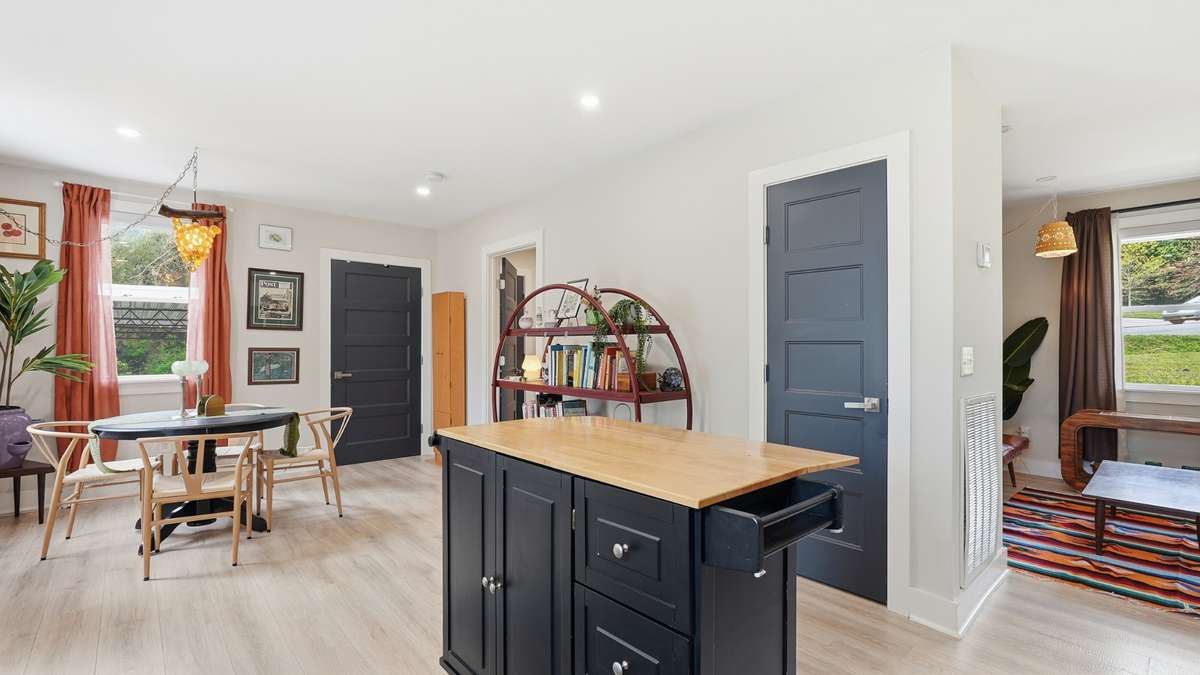 Mobile island to remain with home, laundry off the back of the dining, primary bedroom to back right