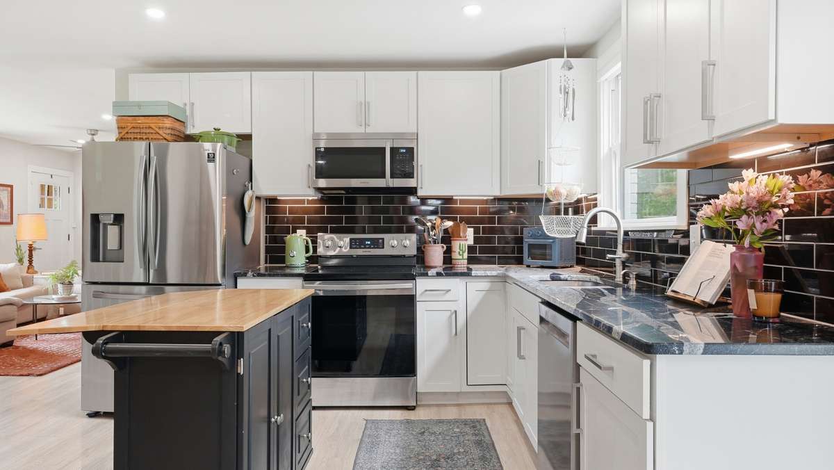 Kitchen, open concept, newer cabinetry, gorgeous stone counters
