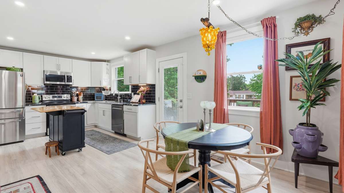 Dining and kitchen with access to back porch